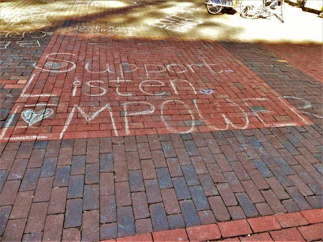 Chalking on the Diag that reads "Support, Listen, Empower"